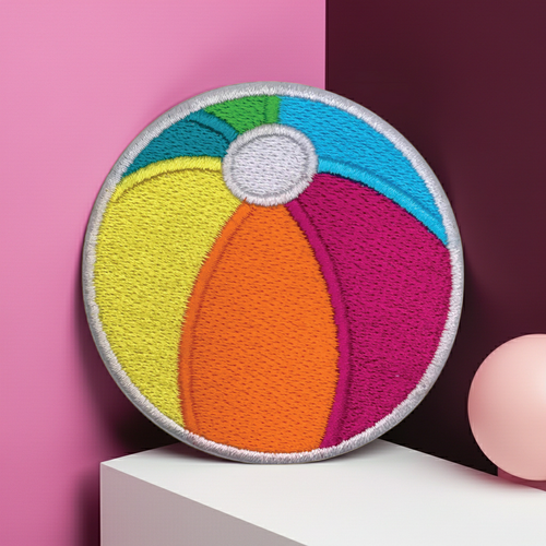 Colorful beach ball patch on a pink and purple background