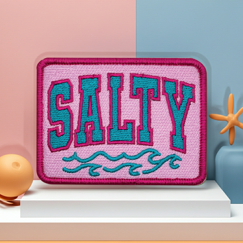 Embroidered patch with 'SALTY' text on a pink background